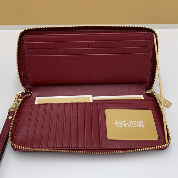 MICHAEL KORS
Leather Continental Wristlet Phone Case Wallet 
Oxblood 
NWT - Picture 7 of 16